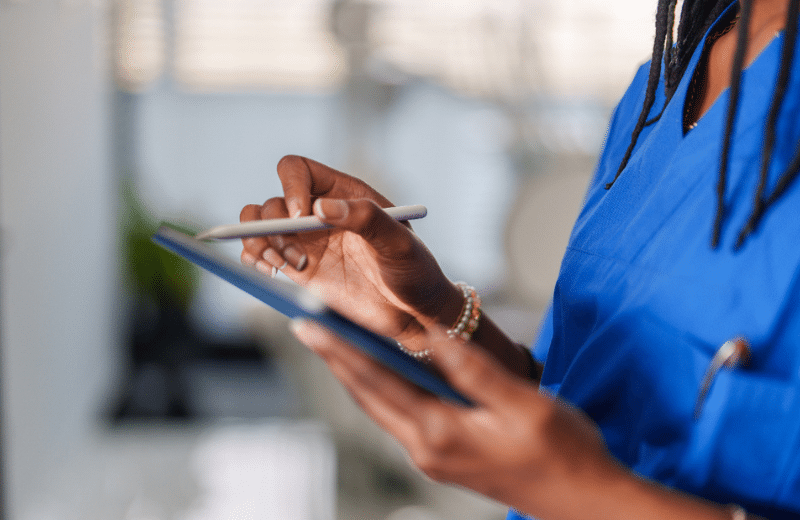 nurse holding an ipad